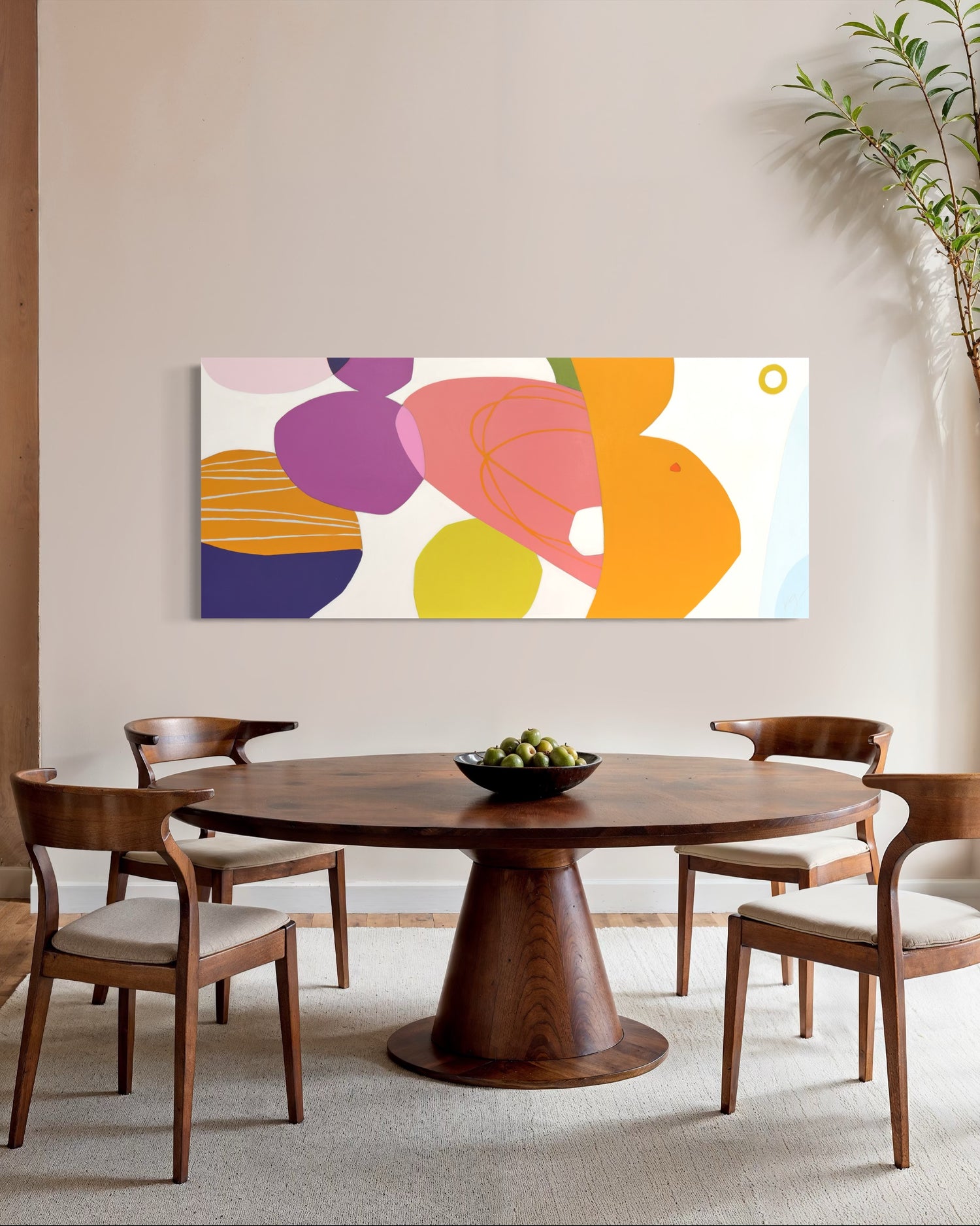 Citrus Salad by Kristen Guest Studio wall art with vibrant orange, purple, and pink abstract citrus shapes on a white frame.
