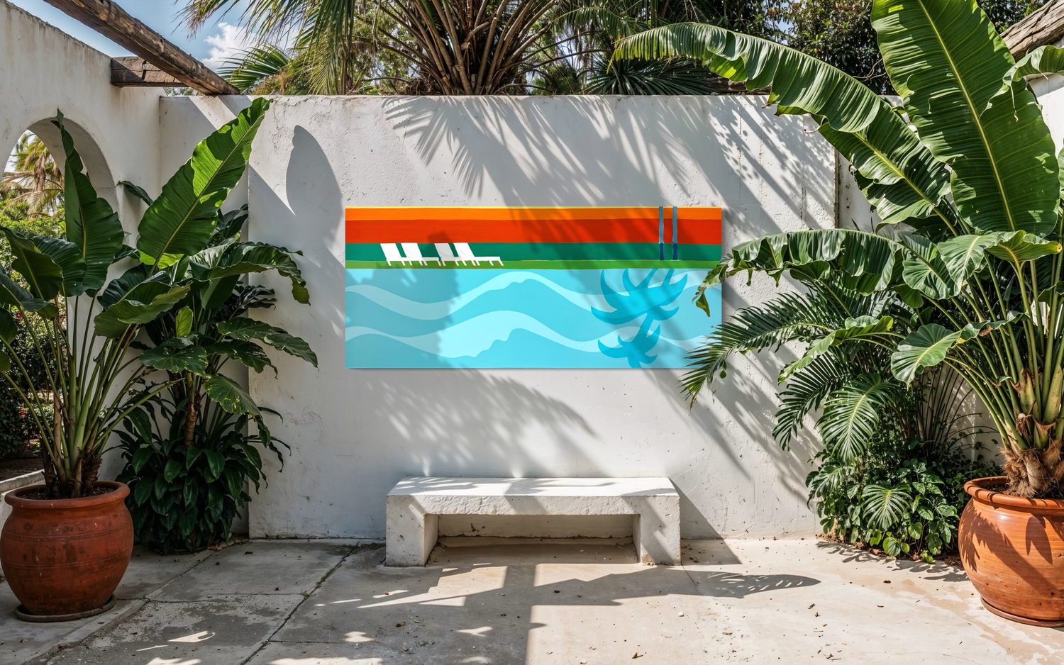 White stucco patio wall with a colorful framed mural showing ocean waves, surrounded by large green banana leaves and potted plants.